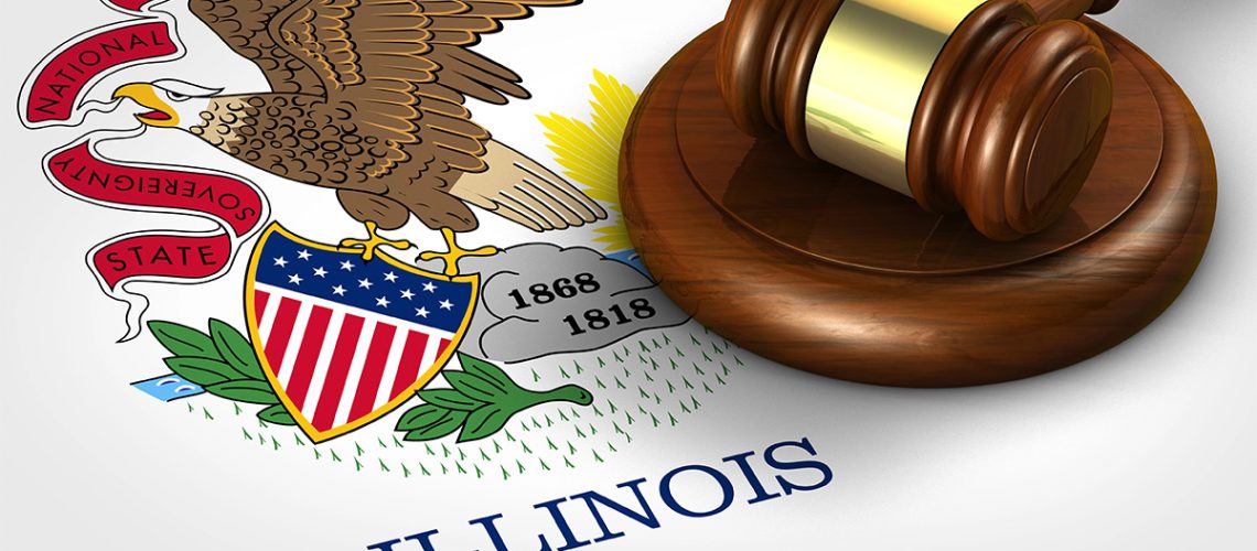 A wooden gavel sits atop the Illinois state flag