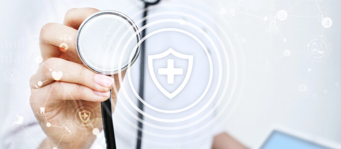 A doctor holding up a stethoscope with a shield and cross in the foreground representing security