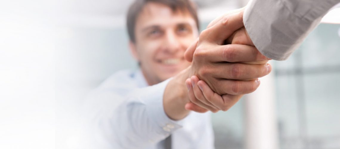 depositphotos_6082642-stock-photo-closeup-of-business-shaking-hands